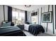 Charming bedroom with two twin beds, dark green accents, and large windows at 00 Handsome Dr, Johns Island, SC 29455