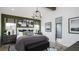 Relaxing main bedroom with dark green accent wall and ensuite bathroom at 00 Handsome Dr, Johns Island, SC 29455