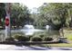 Serene pond with water fountains and lush greenery at 818 Club Cottage Court, Edisto Beach, SC 29438