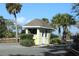 Quaint yellow guard house at the entrance at 818 Club Cottage Court, Edisto Beach, SC 29438