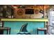 Fun tiki bar with a tropical theme, perfect for entertaining at 818 Club Cottage Court, Edisto Beach, SC 29438