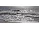 Waves rolling into shore on a sunny day at 818 Club Cottage Court, Edisto Beach, SC 29438