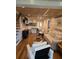 Open living space with kitchen island, bamboo floors, and a comfy couch at 818 Club Cottage Court, Edisto Beach, SC 29438