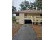 Well-maintained exterior with a covered carport and landscaping at 818 Club Cottage Court, Edisto Beach, SC 29438