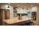 Modern kitchen boasting white cabinets, stainless steel appliances, and a large island at 818 Club Cottage Court, Edisto Beach, SC 29438