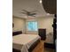 Main bedroom with a king-size bed, dresser, and ceiling fan at 818 Club Cottage Court, Edisto Beach, SC 29438