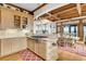 Modern kitchen with light wood cabinets, gas cooktop, and ocean views at 1408 Palmetto Blvd, Edisto Island, SC 29438