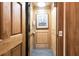 Private home elevator with wood paneling and artwork at 1408 Palmetto Blvd, Edisto Island, SC 29438