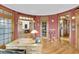 Spacious home office with built-in bookcases and hardwood floors at 1408 Palmetto Blvd, Edisto Island, SC 29438