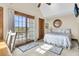 Comfortable bedroom with queen-size bed and access to balcony at 1408 Palmetto Blvd, Edisto Island, SC 29438