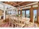 Bright dining room with a large table, hardwood floors, and scenic ocean views at 1408 Palmetto Blvd, Edisto Island, SC 29438