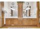 Double vanity bathroom with wood cabinets and large mirror at 1408 Palmetto Blvd, Edisto Island, SC 29438