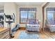 Charming bedroom with elliptical, crib, and built-in mirrored closet at 1408 Palmetto Blvd, Edisto Island, SC 29438