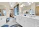 Elegant bathroom with double vanity and soaking tub at 1408 Palmetto Blvd, Edisto Island, SC 29438