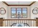 Elegant landing with chandelier and views of the neighborhood at 1408 Palmetto Blvd, Edisto Island, SC 29438