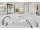 Spa-like bathroom with a large corner bathtub at 1408 Palmetto Blvd, Edisto Island, SC 29438