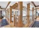 Bright hallway with hardwood floors, wood columns, and coffered ceilings at 1408 Palmetto Blvd, Edisto Island, SC 29438