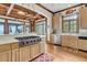 Modern kitchen with stainless steel appliances and light wood cabinets at 1408 Palmetto Blvd, Edisto Island, SC 29438