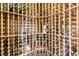 Custom wine cellar with numerous bottles on wooden racks at 1408 Palmetto Blvd, Edisto Island, SC 29438