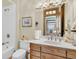 Charming bathroom with wood vanity and shower/tub combo at 1408 Palmetto Blvd, Edisto Island, SC 29438