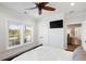 Spacious bedroom with hardwood floors, a TV, and a private balcony at 3583 Somerset Hills Ct, Mount Pleasant, SC 29466