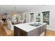 Open concept kitchen with island, hardwood floors, and view of living room at 3583 Somerset Hills Ct, Mount Pleasant, SC 29466