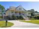 Charming two-story home with a large porch and landscaped yard at 3583 Somerset Hills Ct, Mount Pleasant, SC 29466