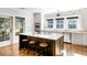 Modern kitchen with island, stainless steel appliances, and brick accent wall at 3583 Somerset Hills Ct, Mount Pleasant, SC 29466