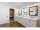 Elegant bathroom with double vanity, walk-in shower, and hardwood floors at 3583 Somerset Hills Ct, Mount Pleasant, SC 29466