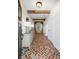 Inviting entryway with herringbone brick floor and rustic console table at 3583 Somerset Hills Ct, Mount Pleasant, SC 29466