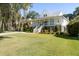 Elevated home with spacious porch and manicured lawn at 3583 Somerset Hills Ct, Mount Pleasant, SC 29466