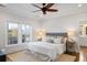 Spacious bedroom with ceiling fan, hardwood floors, and access to balcony at 3583 Somerset Hills Ct, Mount Pleasant, SC 29466