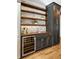 Built-in wet bar with wine cooler and rustic wood shelving at 3583 Somerset Hills Ct, Mount Pleasant, SC 29466