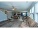 Spacious living room with two brown leather couches and a wooden coffee table at 297 Oglethorpe Cir, Moncks Corner, SC 29461