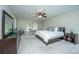 Spacious main bedroom with king bed, dresser, and ceiling fan at 297 Oglethorpe Cir, Moncks Corner, SC 29461