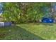 Large backyard with mature trees and grassy area at 4621 Durant Ave, North Charleston, SC 29405