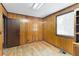 Simple office with wood paneling, hardwood floors and a door at 4621 Durant Ave, North Charleston, SC 29405