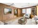 Office space with wood paneling, hardwood floors, and staged furniture at 4621 Durant Ave, North Charleston, SC 29405