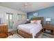 Bright bedroom with water views and wood bed at 1712 Live Oak Park, Seabrook Island, SC 29455