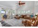Living room with vaulted ceiling, access to screened porch and marsh views at 1712 Live Oak Park, Seabrook Island, SC 29455