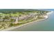 Aerial view of the community, showing beachfront property, golf course, and clubhouse at 1712 Live Oak Park, Seabrook Island, SC 29455