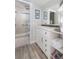 Updated bathroom with white vanity, walk-in shower, and herringbone tile floor at 1712 Live Oak Park, Seabrook Island, SC 29455