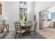 Bright dining area with round table and four chairs, kitchen view at 1712 Live Oak Park, Seabrook Island, SC 29455