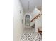 Elegant entryway with geometric tile floor and wooden staircase at 1712 Live Oak Park, Seabrook Island, SC 29455