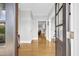 Light-filled entryway with hardwood floors and view to living area at 1000 Rivershore Rd, Charleston, SC 29492