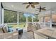 Relaxing screened porch overlooking a lush green backyard at 1000 Rivershore Rd, Charleston, SC 29492