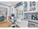 Built-in breakfast nook with window seat and view of backyard at 1000 Rivershore Rd, Charleston, SC 29492