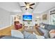 Spacious living room with hardwood floors, sectional and large TV at 1000 Rivershore Rd, Charleston, SC 29492