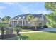 Brick house with front yard and palm trees at 1000 Rivershore Rd, Charleston, SC 29492