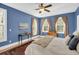 Spacious bedroom with a queen-size bed, wooden dresser, and large windows at 1000 Rivershore Rd, Charleston, SC 29492